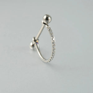 Piercing barbell com zircônias visto de perfil