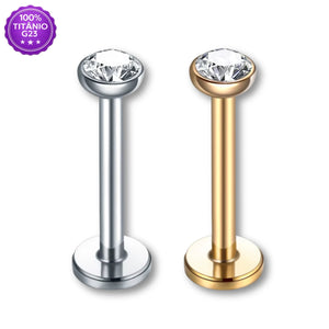 Piercing labret de Titânio G23 com zircônia nas cores prateada e dourada, em fundo branco
